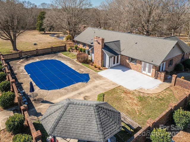 view of pool featuring a fenced in pool, french doors, fence, and a patio