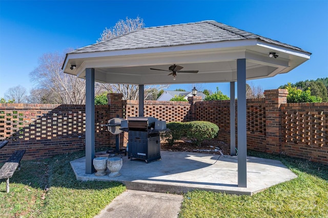 view of patio / terrace featuring a ceiling fan, a fenced backyard, and a gazebo