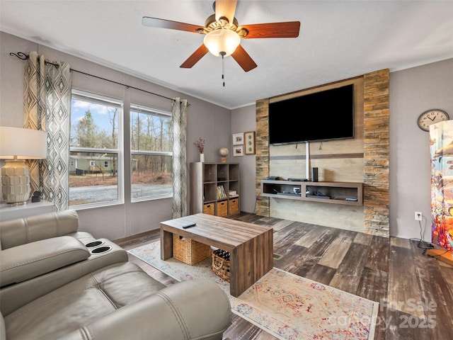 living room with a ceiling fan and wood finished floors