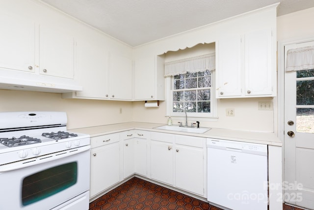 kitchen with white cabinets, white appliances, under cabinet range hood, and light countertops