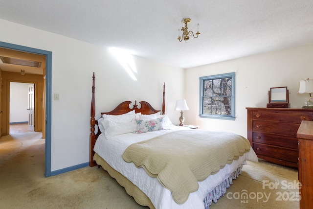 bedroom with light carpet and baseboards