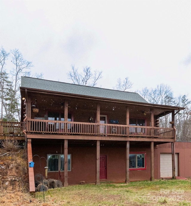 rear view of property with log siding and a wooden deck