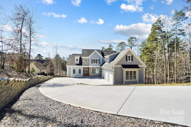 view of front of home with a garage and concrete driveway