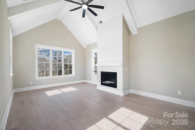 unfurnished living room featuring a fireplace, visible vents, light wood-style floors, a ceiling fan, and baseboards