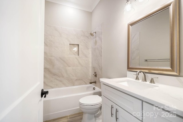 full bath featuring tub / shower combination, vanity, toilet, and wood finished floors