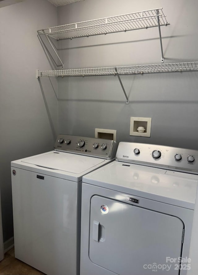 washroom featuring laundry area and independent washer and dryer