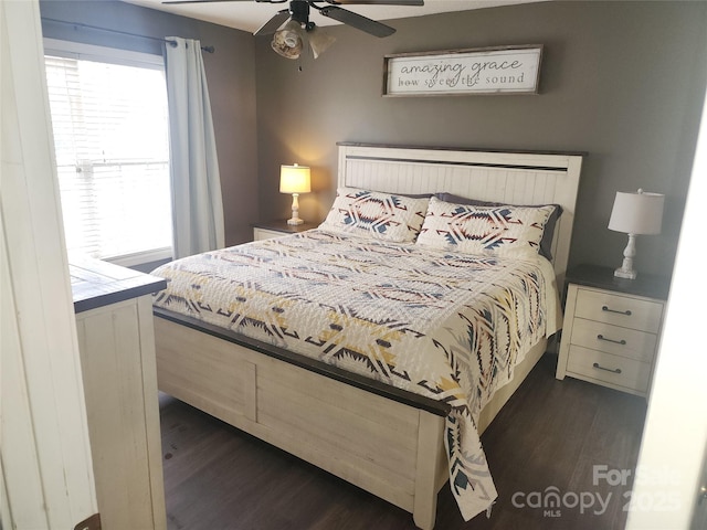 bedroom featuring dark wood-style floors and ceiling fan