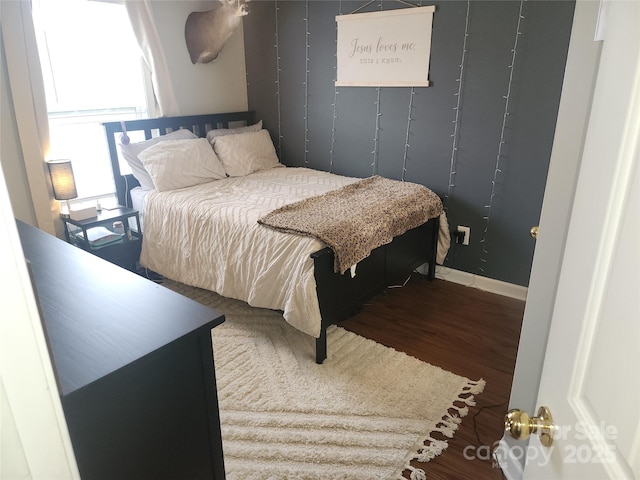 bedroom with wood finished floors