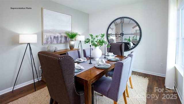 dining area with wood finished floors and baseboards
