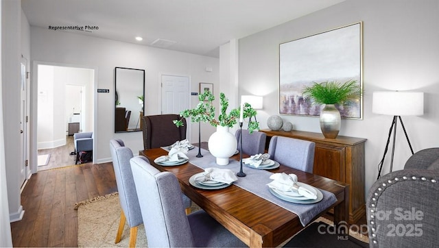 dining space featuring hardwood / wood-style flooring, baseboards, and recessed lighting