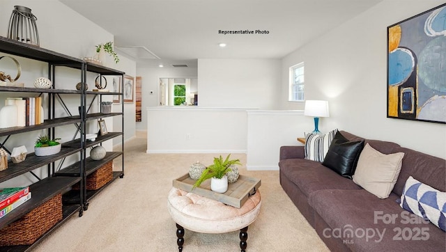 living room featuring visible vents, baseboards, carpet flooring, and recessed lighting