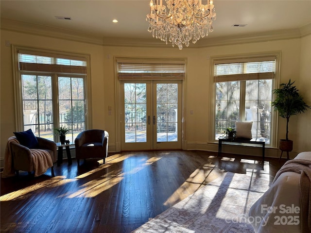 doorway to outside featuring plenty of natural light, french doors, and crown molding