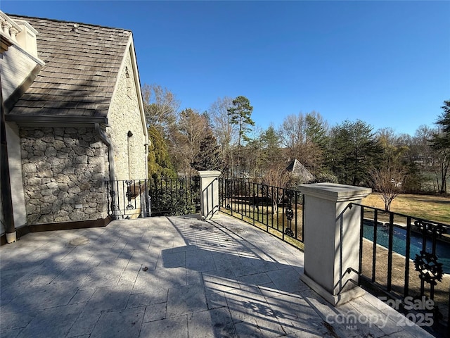 exterior space with a fenced in pool