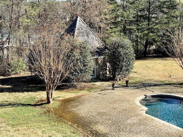 exterior space featuring a patio area and a yard