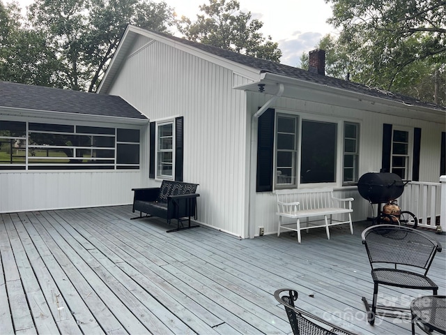 wooden terrace featuring area for grilling