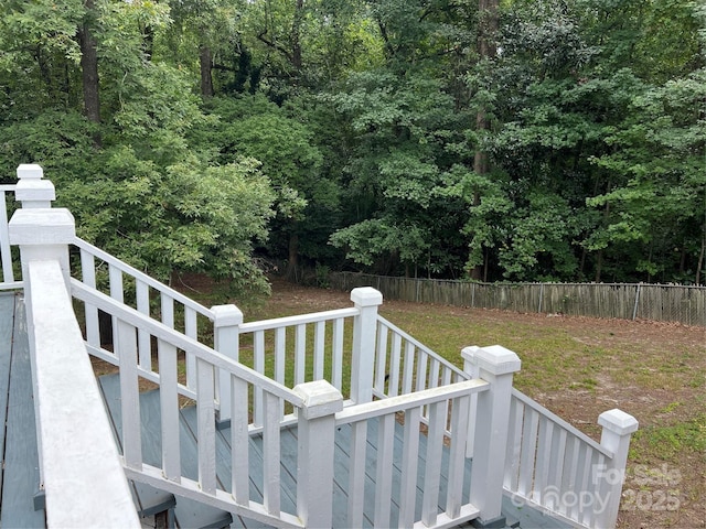 exterior space featuring fence and stairway