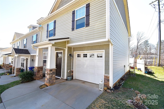 view of front of house with an attached garage, stone siding, a residential view, and concrete driveway