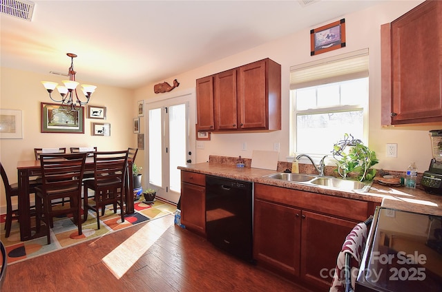 kitchen featuring dark wood-style floors, visible vents, electric range oven, a sink, and dishwasher