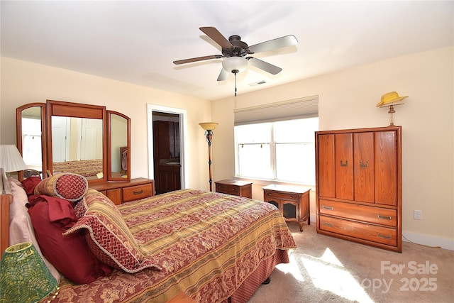 bedroom with light carpet, baseboards, visible vents, and a ceiling fan