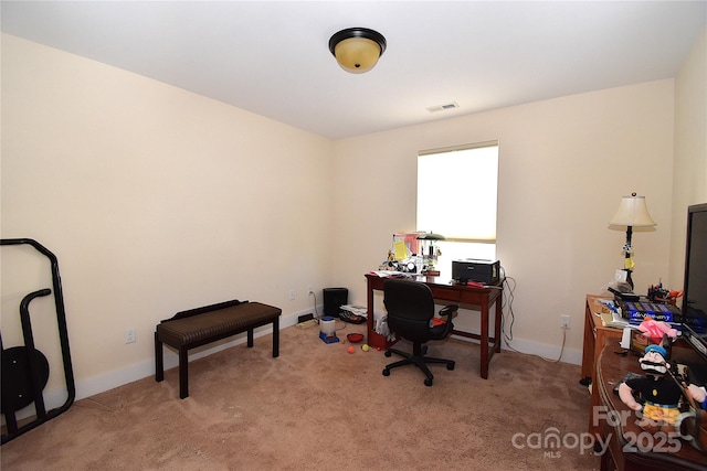 office area featuring light carpet, baseboards, and visible vents