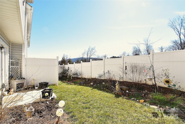 view of yard with a fenced backyard