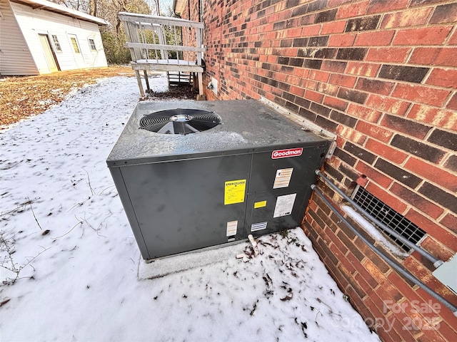 details with brick siding and central AC unit