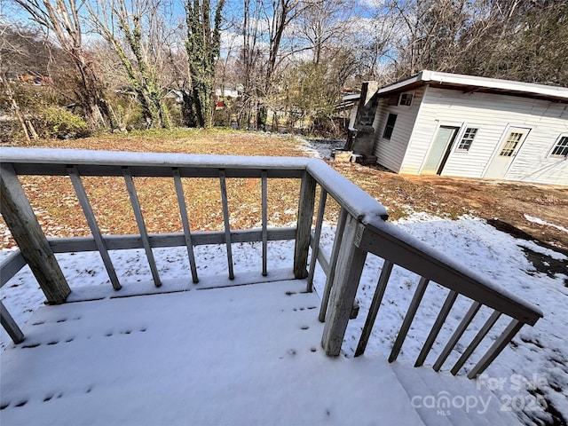 view of snow covered deck