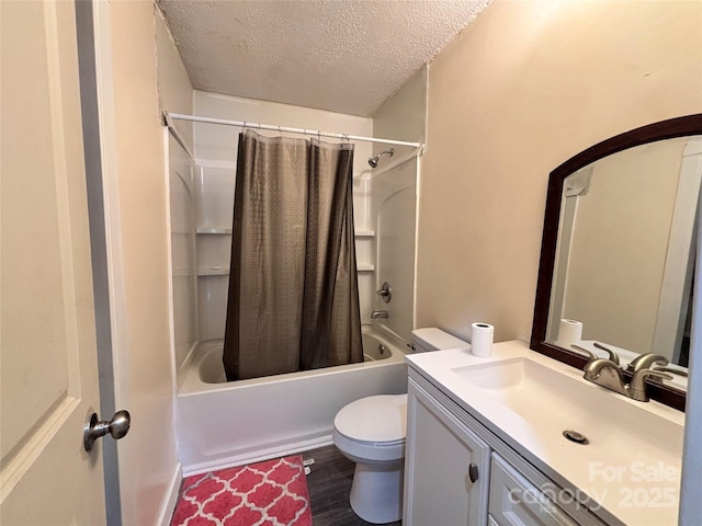 full bath with toilet, wood finished floors, shower / bath combo with shower curtain, a textured ceiling, and vanity