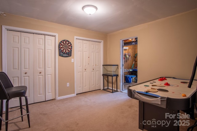 playroom with light carpet and baseboards