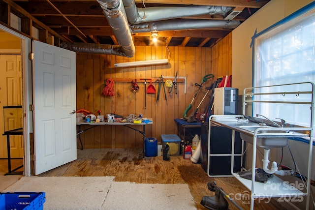 below grade area with wood finished floors and wooden walls