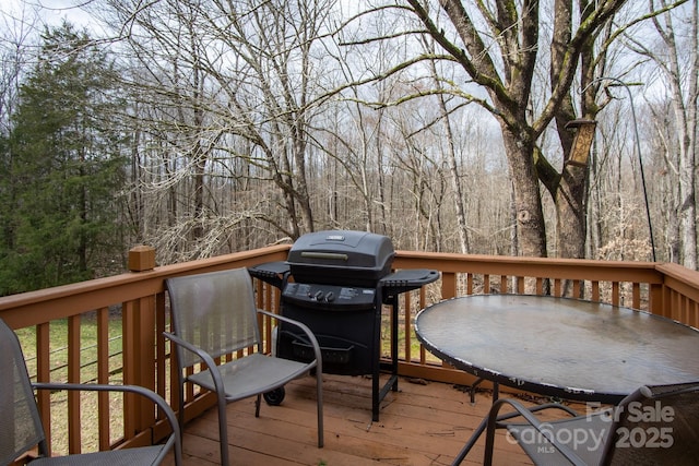 wooden terrace with area for grilling