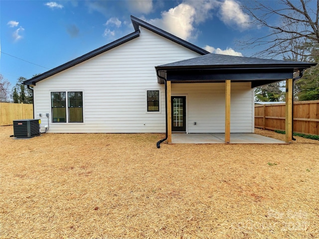 back of house with fence, cooling unit, and a patio