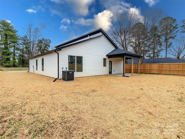 back of property with a patio, fence, and central air condition unit