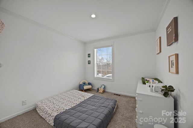 bedroom featuring ornamental molding, carpet flooring, and baseboards