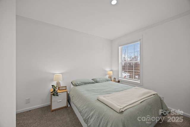 bedroom with carpet floors, ornamental molding, and baseboards