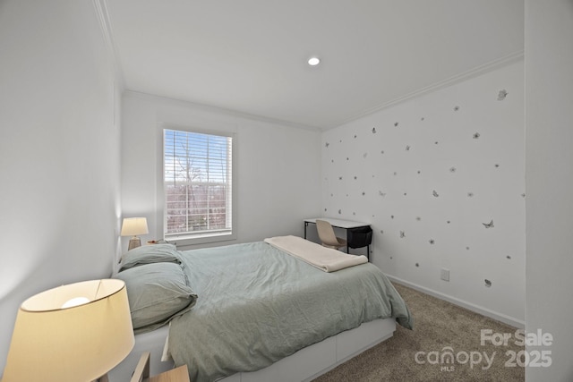 bedroom featuring baseboards, ornamental molding, and carpet flooring