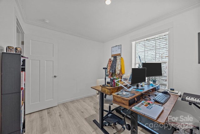 home office with baseboards, crown molding, and light wood finished floors