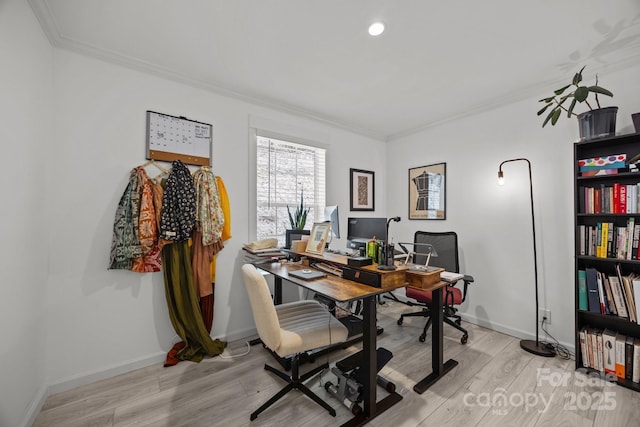 office featuring light wood-style floors, baseboards, and ornamental molding