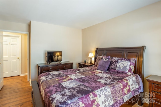 bedroom with light wood-type flooring