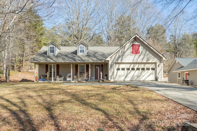 view of front of property with a garage, a front lawn, a porch, and concrete driveway