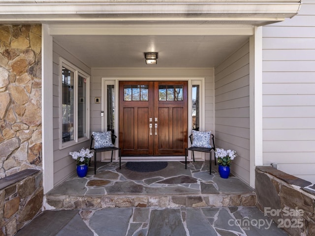 entrance to property with stone siding