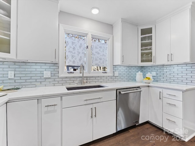 kitchen featuring dark wood finished floors, glass insert cabinets, white cabinets, a sink, and dishwasher