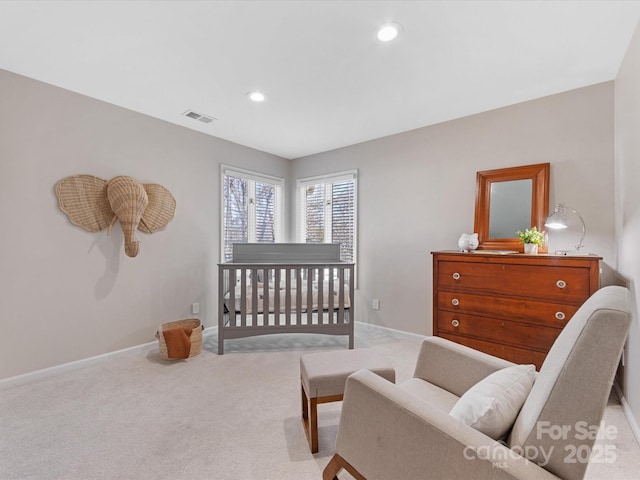 bedroom with light carpet, recessed lighting, visible vents, and baseboards