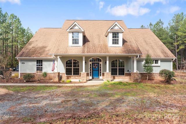 view of front of house featuring covered porch and roof with shingles