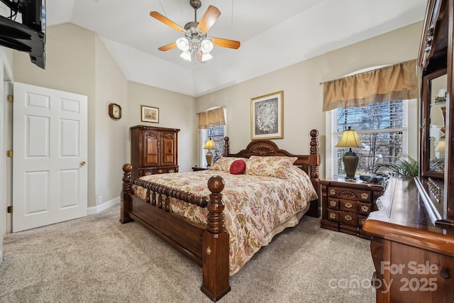 carpeted bedroom with baseboards, vaulted ceiling, and a ceiling fan
