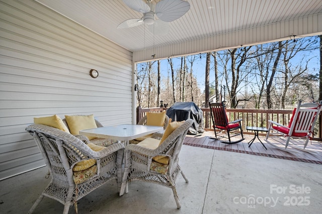 view of patio featuring outdoor dining area, area for grilling, and a ceiling fan