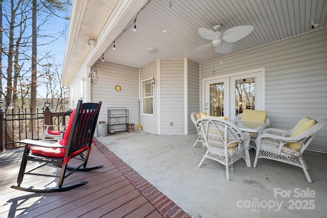 wooden deck with ceiling fan