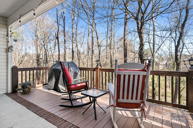 wooden deck with grilling area