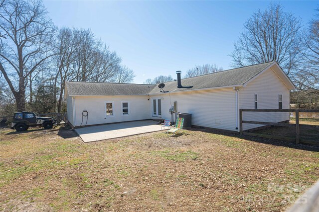 back of property featuring a patio area and fence