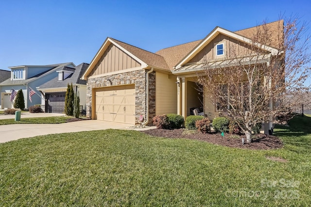 craftsman-style home featuring an attached garage, board and batten siding, stone siding, driveway, and a front lawn